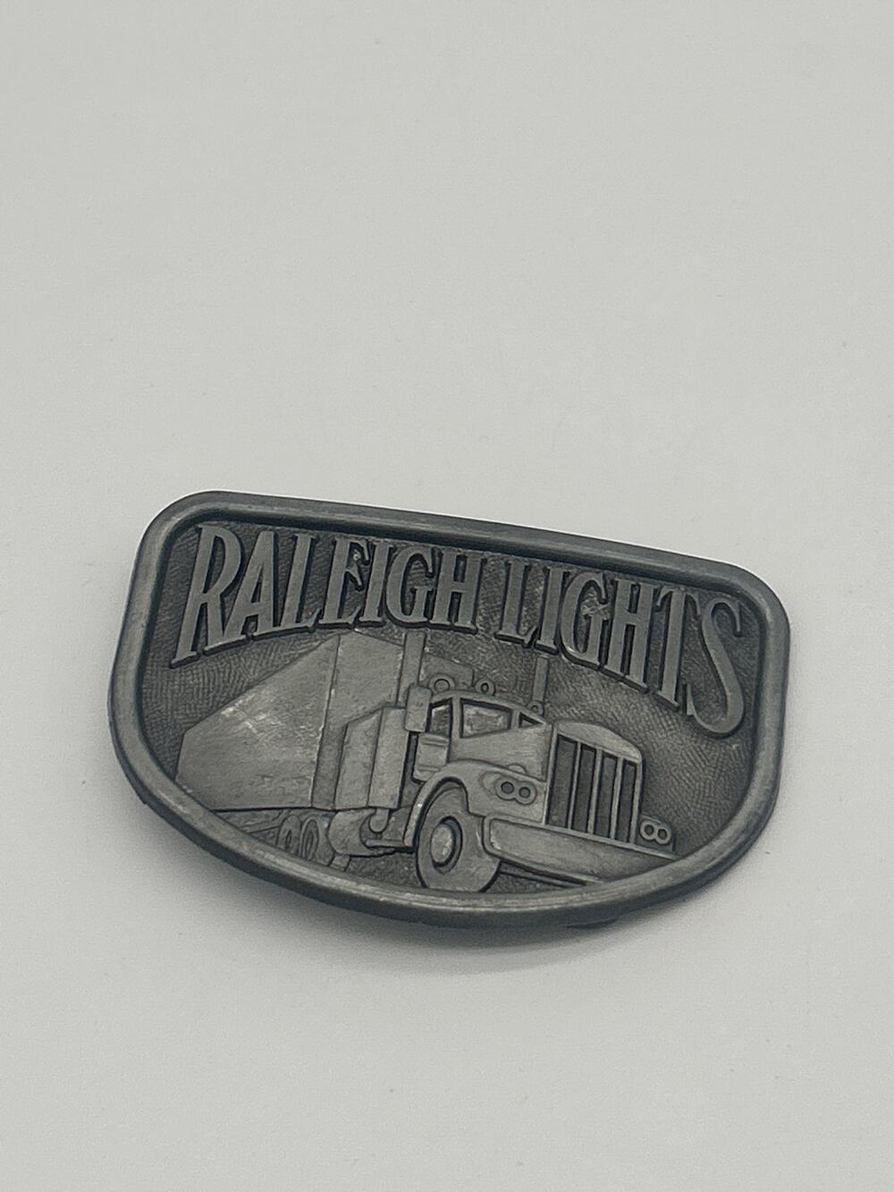 Raleigh Lights Semi Truck Belt Buckle Vintage Style Trucker Western